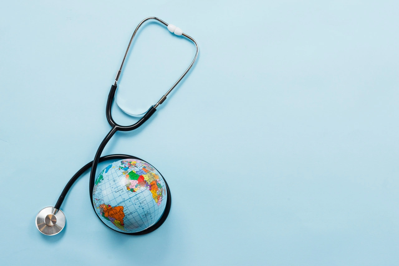 stethoscope-hugging-earth-blue-background